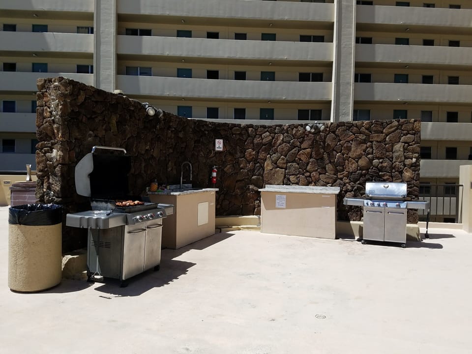 barbecue grilling area next to pool on 5th floor