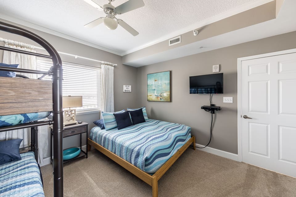 TV with arm to move in the direction you need.  Clean nice lines & subtle colors