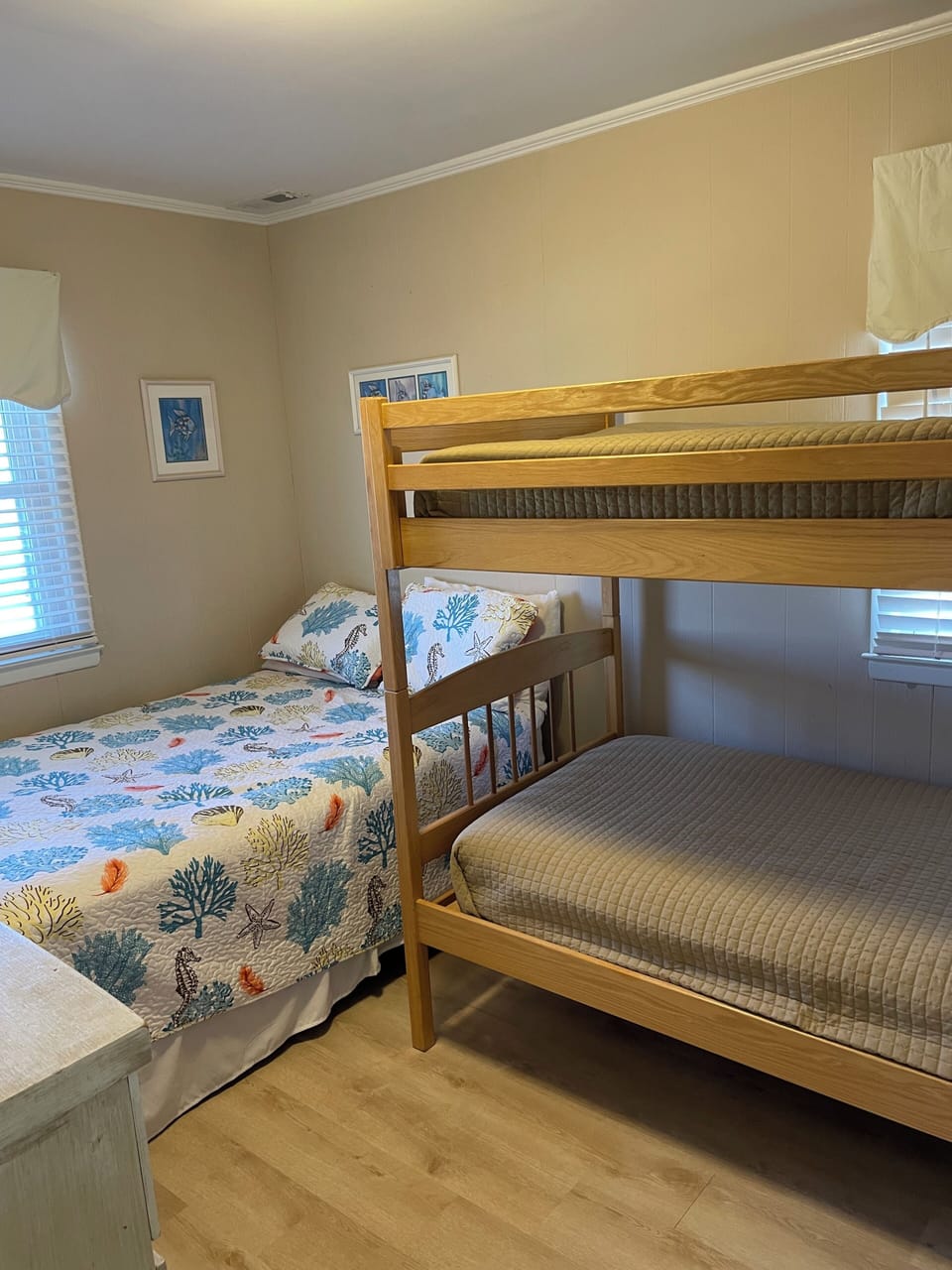 Bedroom with double bed, twin bunk beds and TV