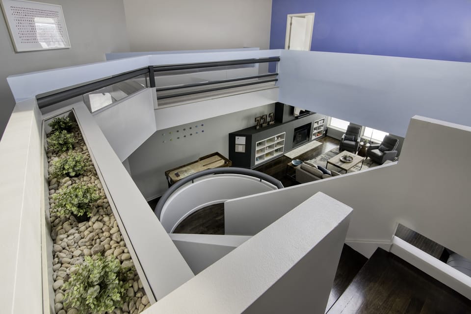 main staircase showing downstairs living area