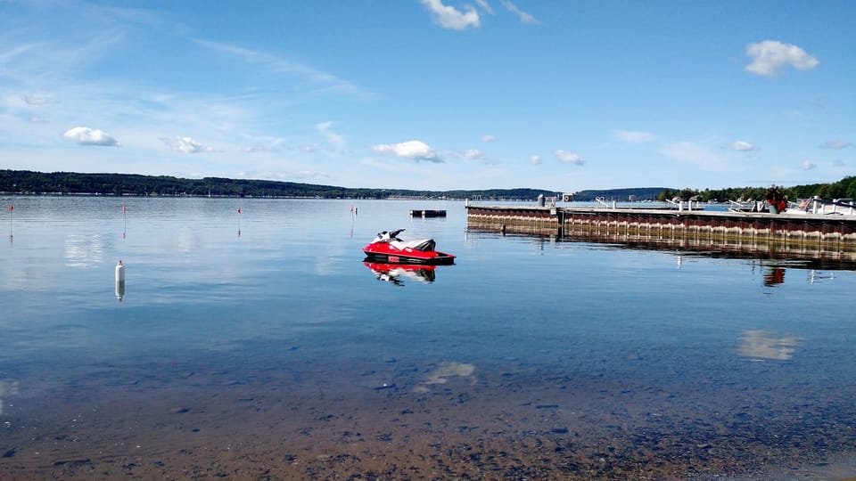 View of Lake Charlevoix from pool. (Jet ski does not come with rental!)
