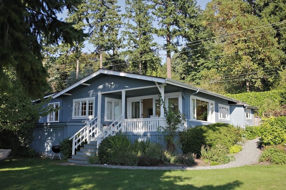 Private home with manicured lawn and flower gardens. 