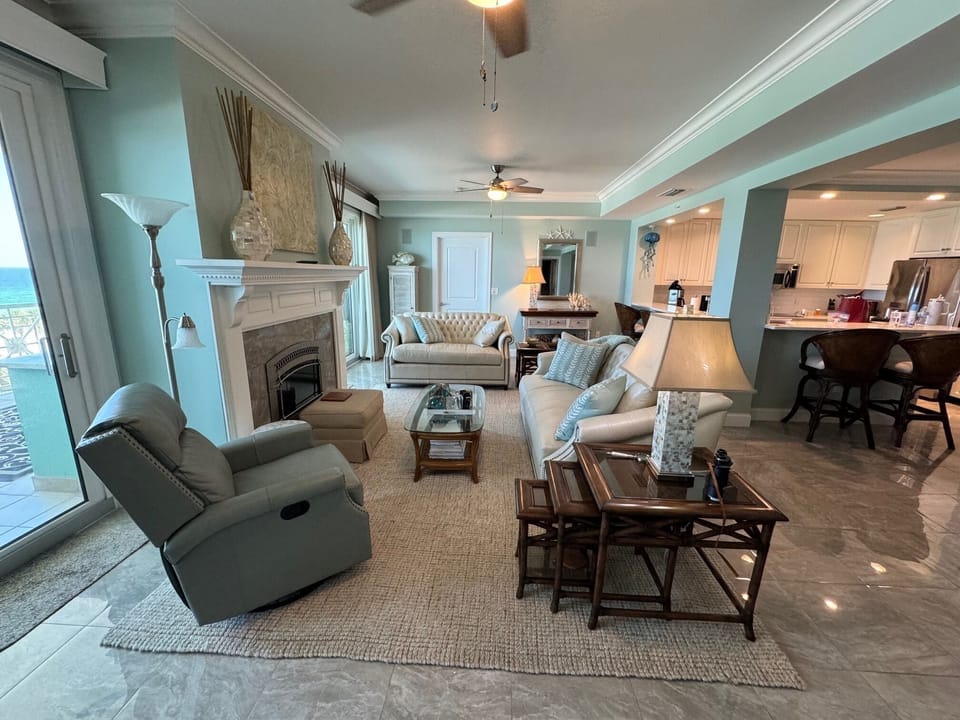 Leather sofa, loveseat, and swivel recliner.