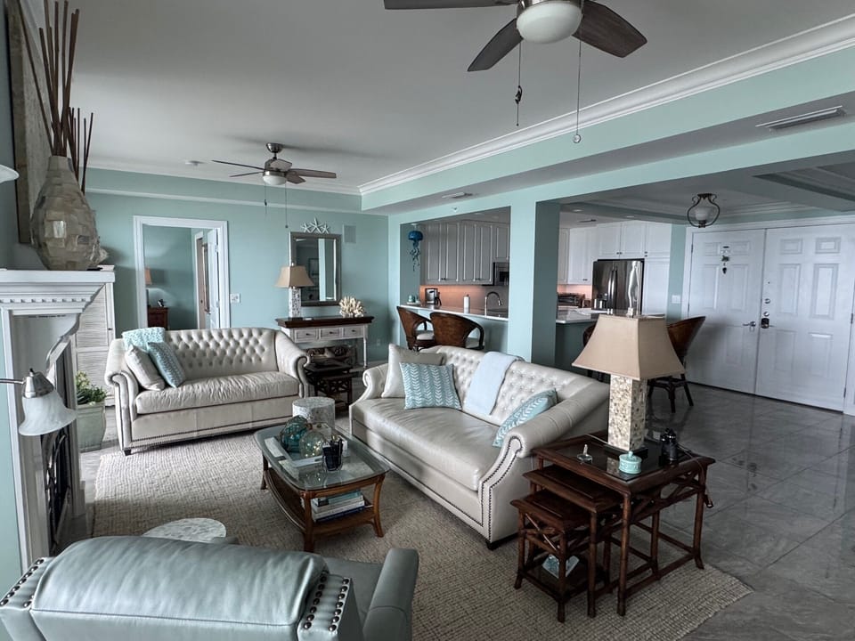 Leather sofa, loveseat, swivel recliner.