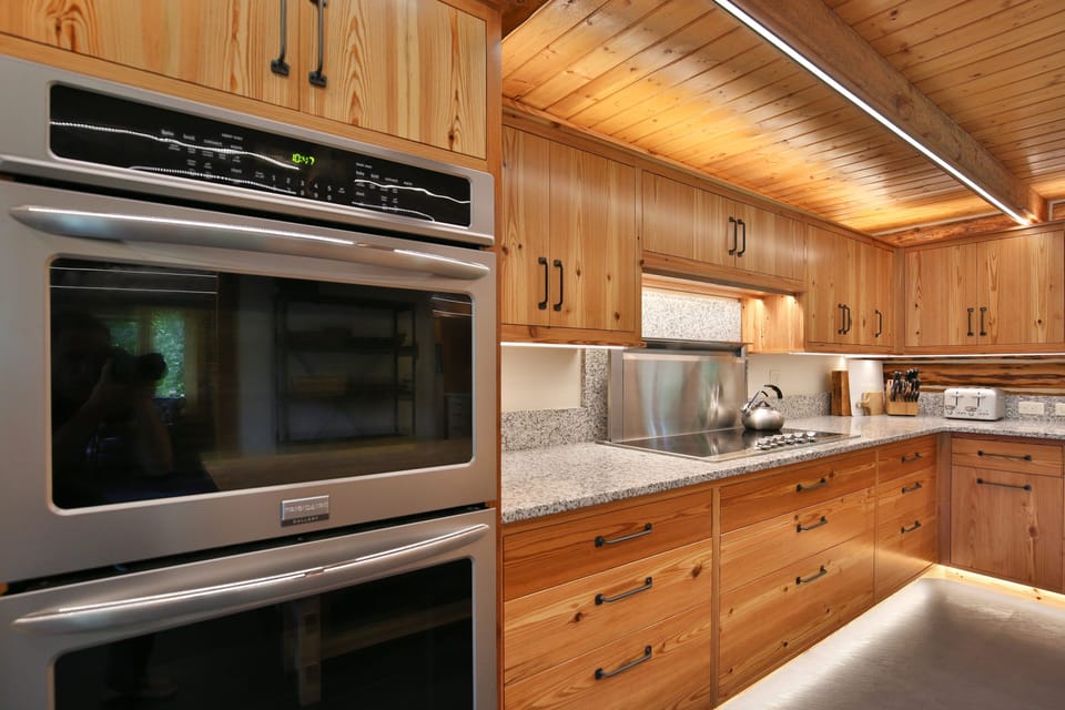 Custom Kitchen with double wall ovens and 6 burner Viking range