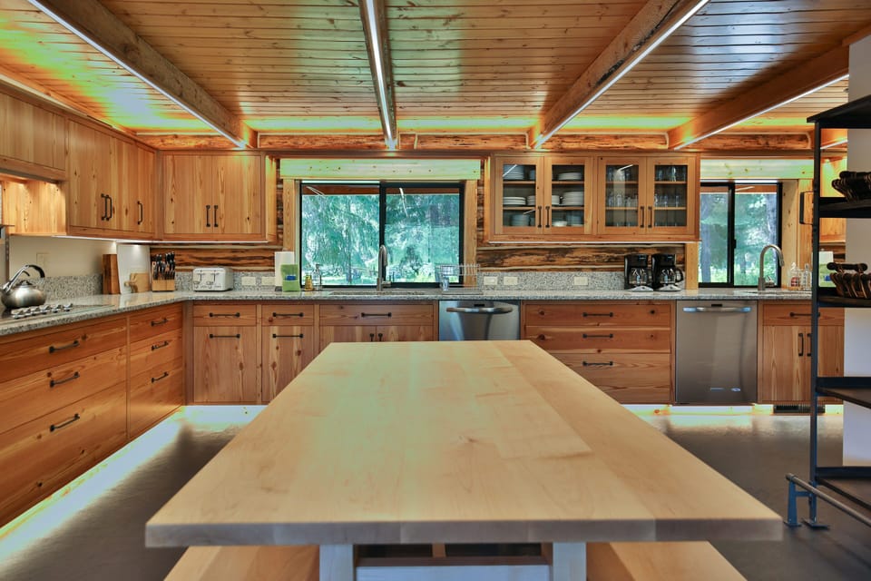 Kitchen work table, two dishwashers and two sinks for easy cooking and clean up