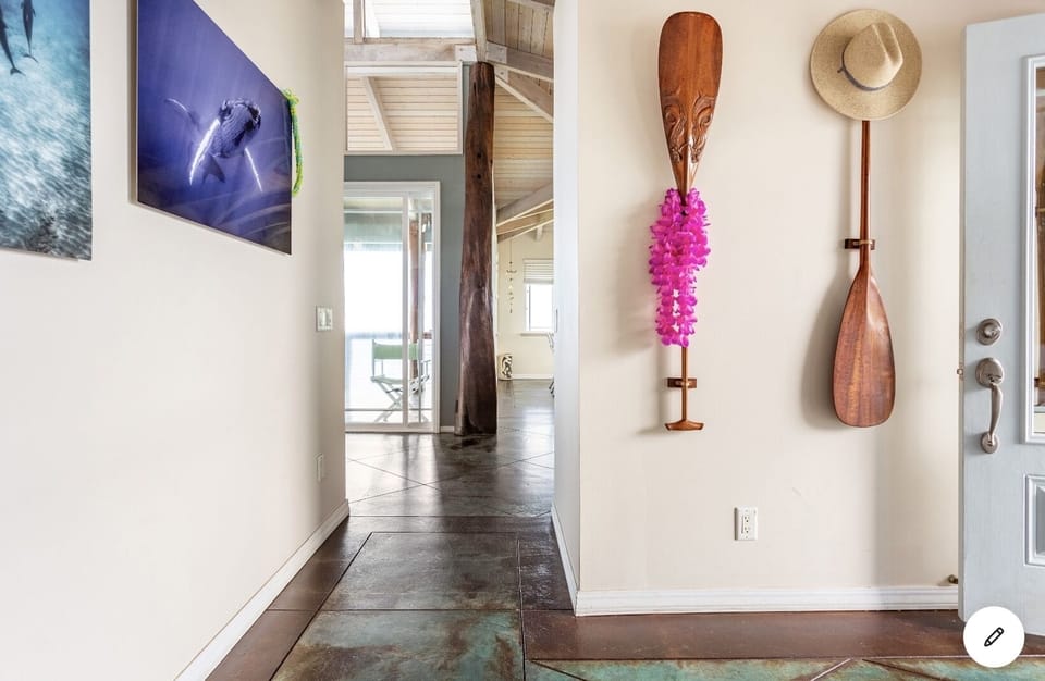 Entry hall with locally made koa outrigger canoe paddles
