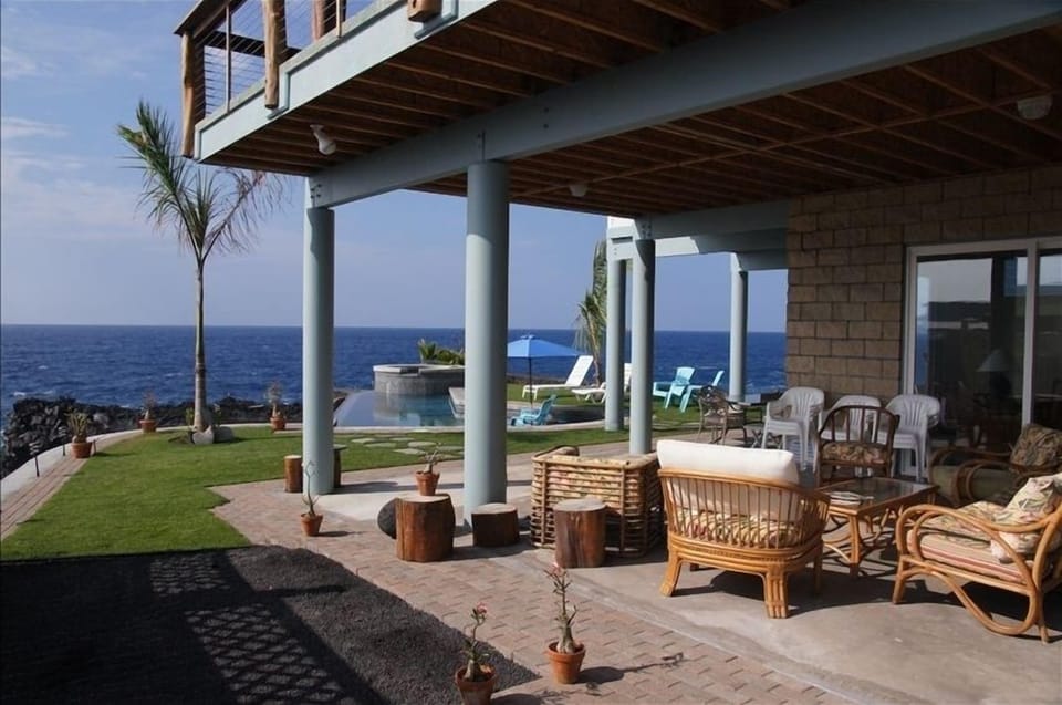 Living area pool side with ping pong table and lawn