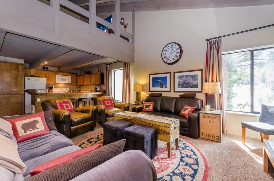 Lots of living room seating in Fireside 305, with loft views overhead!