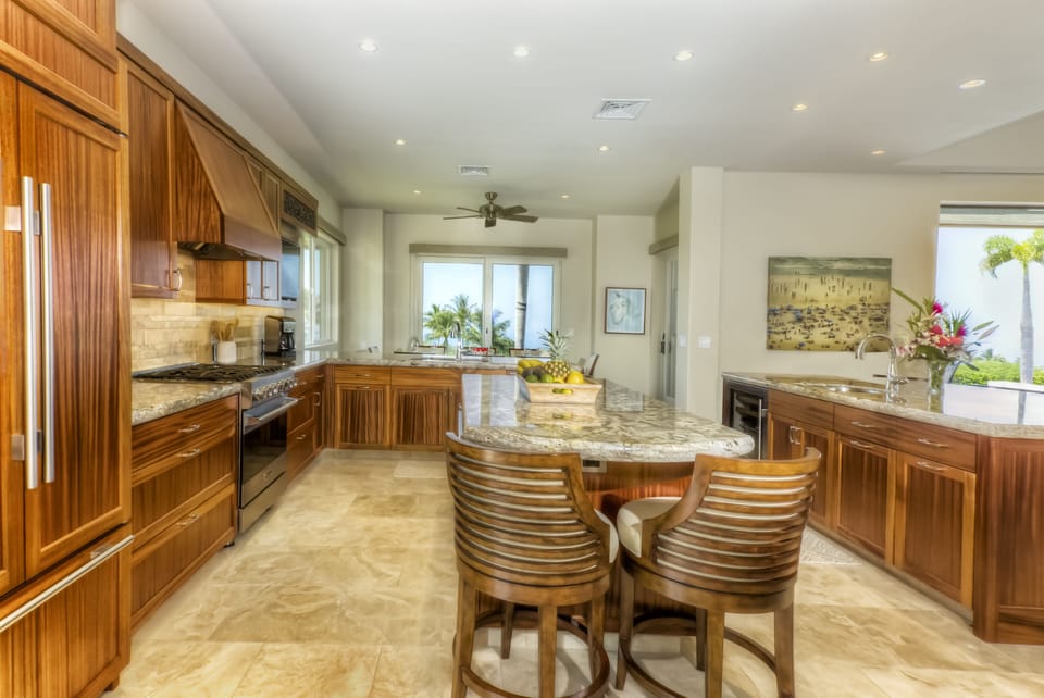 Kitchen featuring top-of-the-line appliances and 2 granite islands to sit around