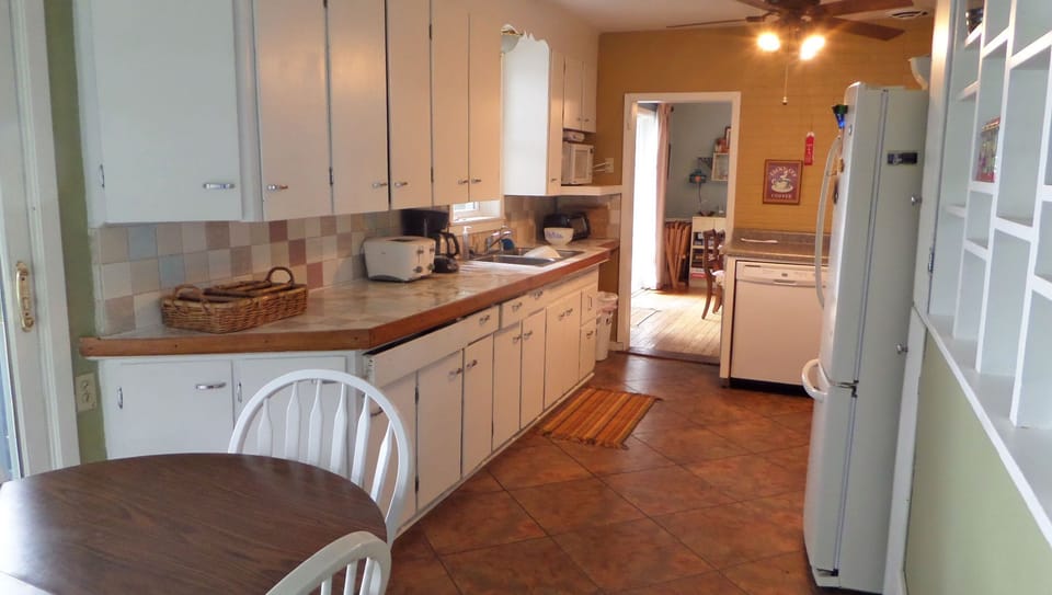 Spacious eat-in kitchen.  Eat breakfast while looking out patio door over lake. 