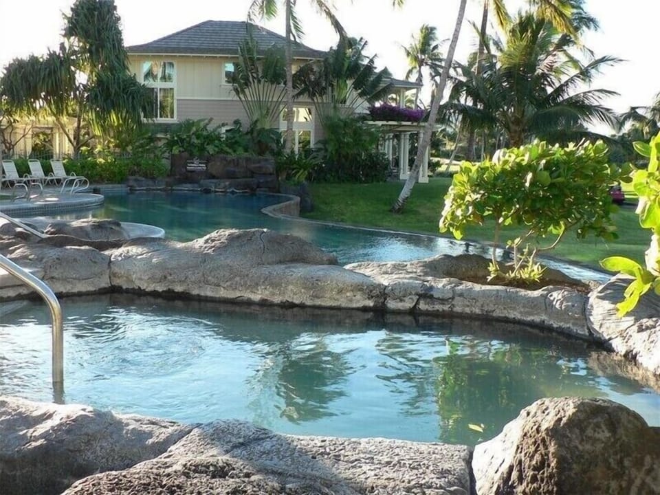 Relax in lava rock hot tub and infinity edge pool.