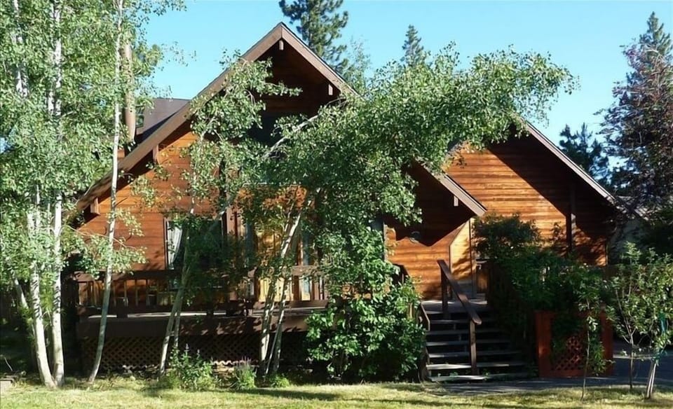 The front yard in summer.  Nice shady deck for a barbecue