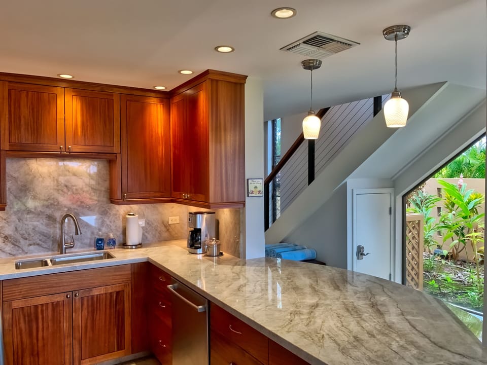 Kitchen with stairs in back ground leading to the upstairs bedrooms