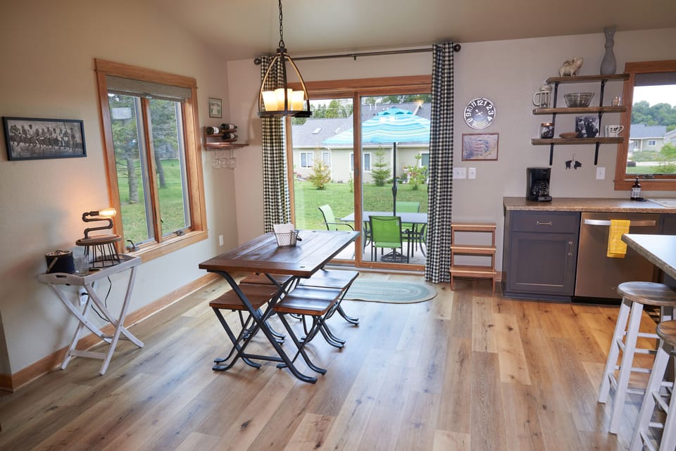 Open dining & kitchen area looks out onto backyard.
