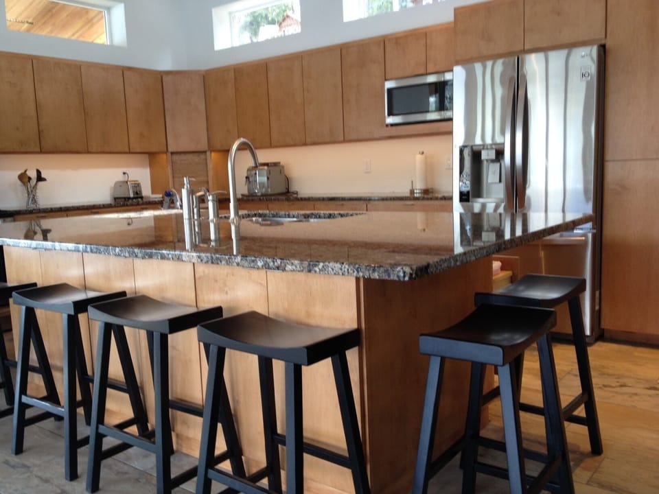 Granite-topped kitchen island with seating for 6