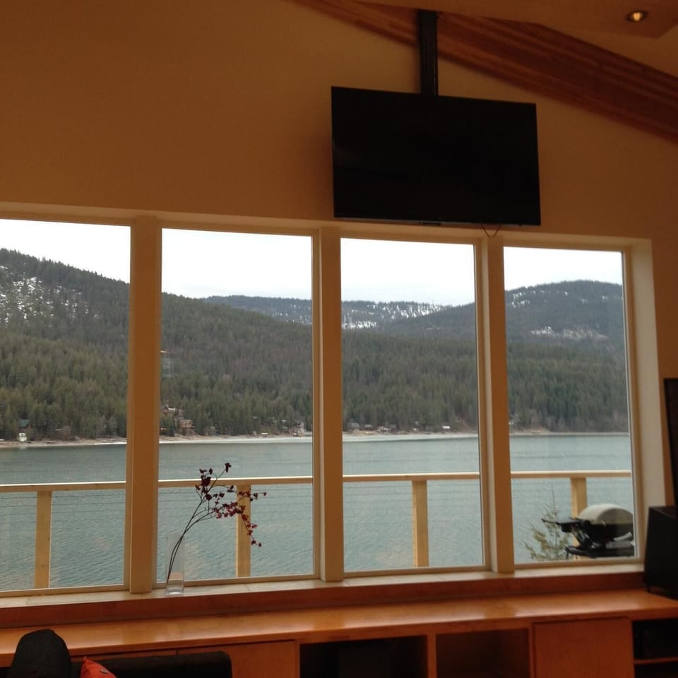 New 60-inch flatscreen TV lowers for viewing. Stereo has iPod, iPad connectivity
