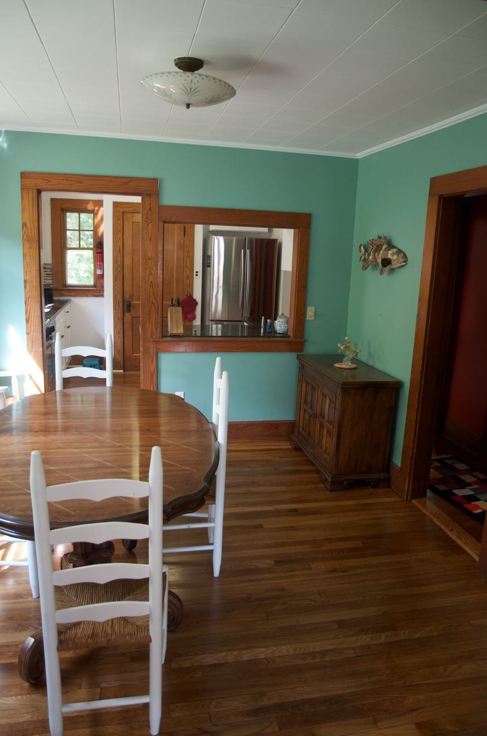 Dining room with view into kitchen