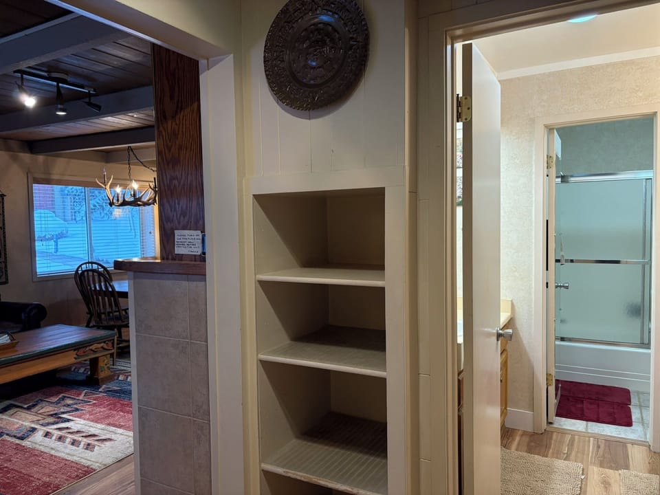 View of Living and Dining Rooms from Front Door - Entrance Hall and Bathroom.