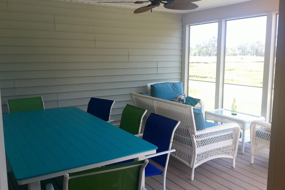 Screen porch for outdoor dining and relaxing with a good book.