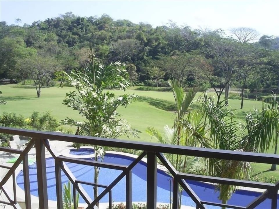 Balcony view overlooking one of the many Veranda pools and golf course.