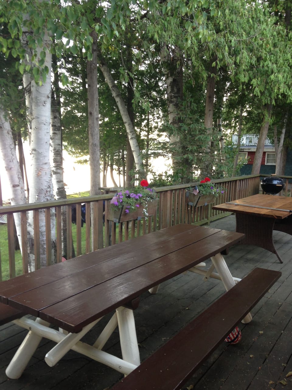 Huge deck with two picnic tables for outdoor dinners 