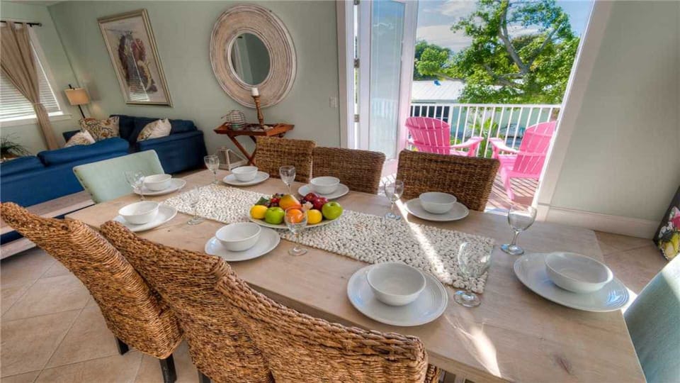 Dining table with seating for 8 to enjoy family meals (plus a breakfast bar).