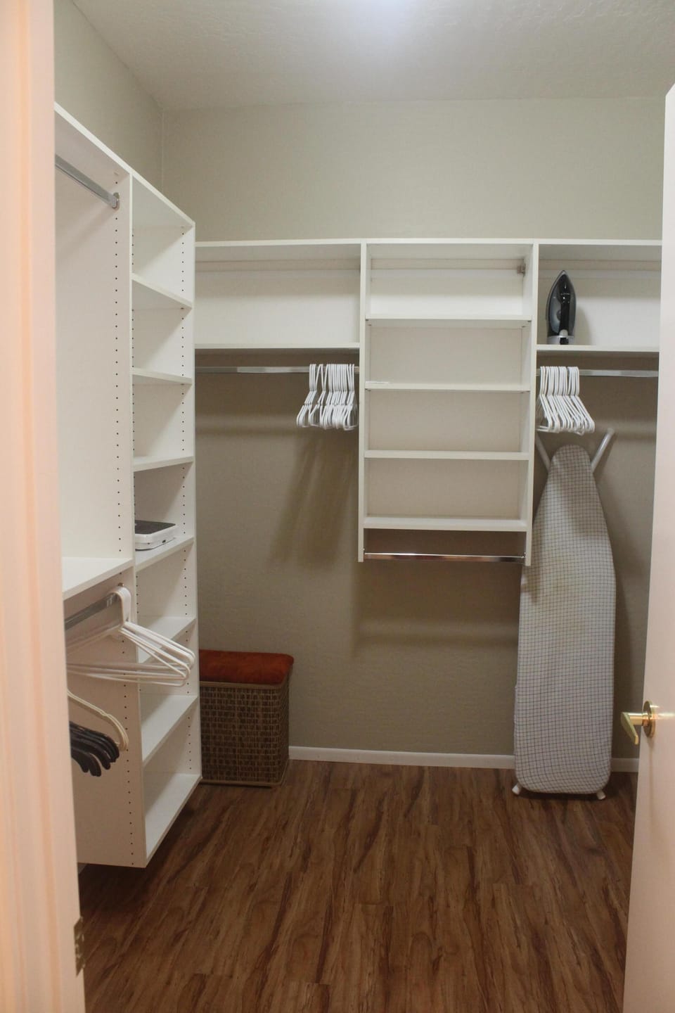 Large master walk-in California closet; lots of hanging and open shelf storage