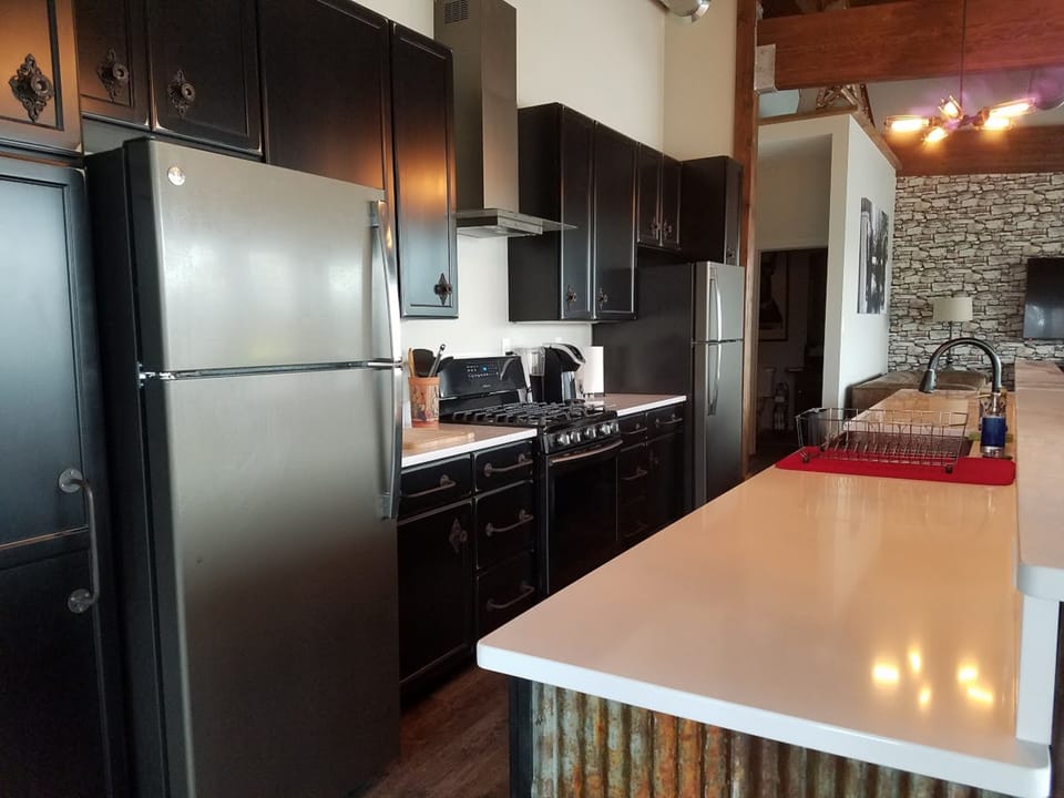 Cooks kitchen with double refrigerators

