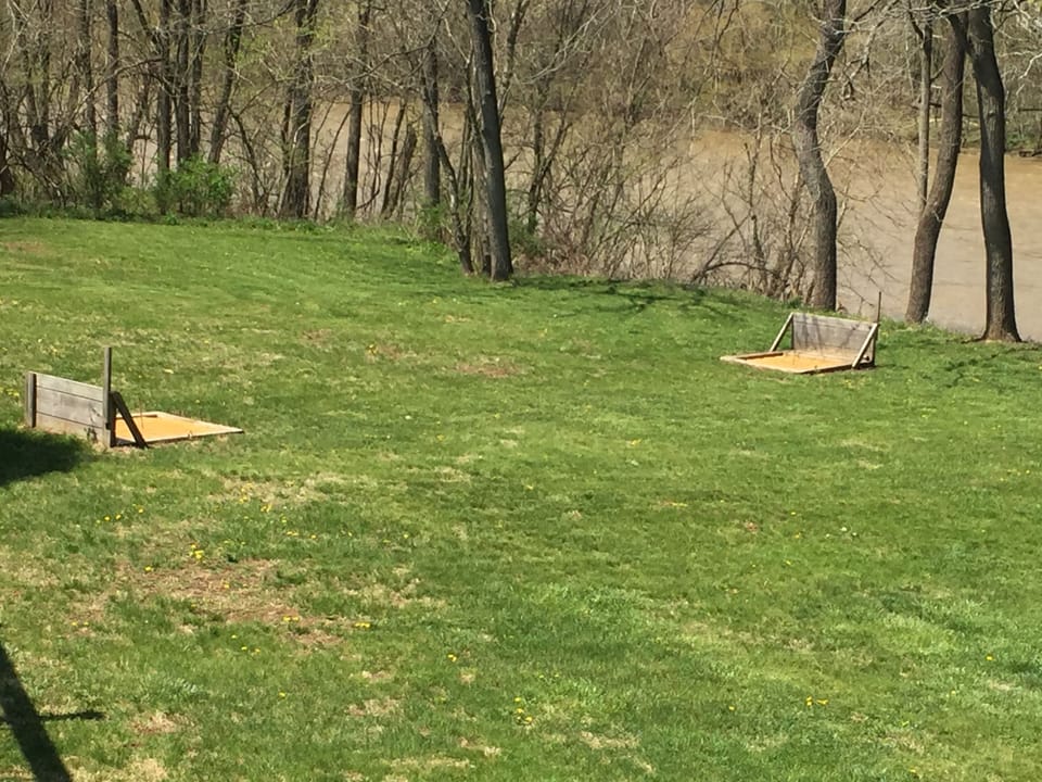 Watch family and friends play horseshoes or cornhole from the deck
