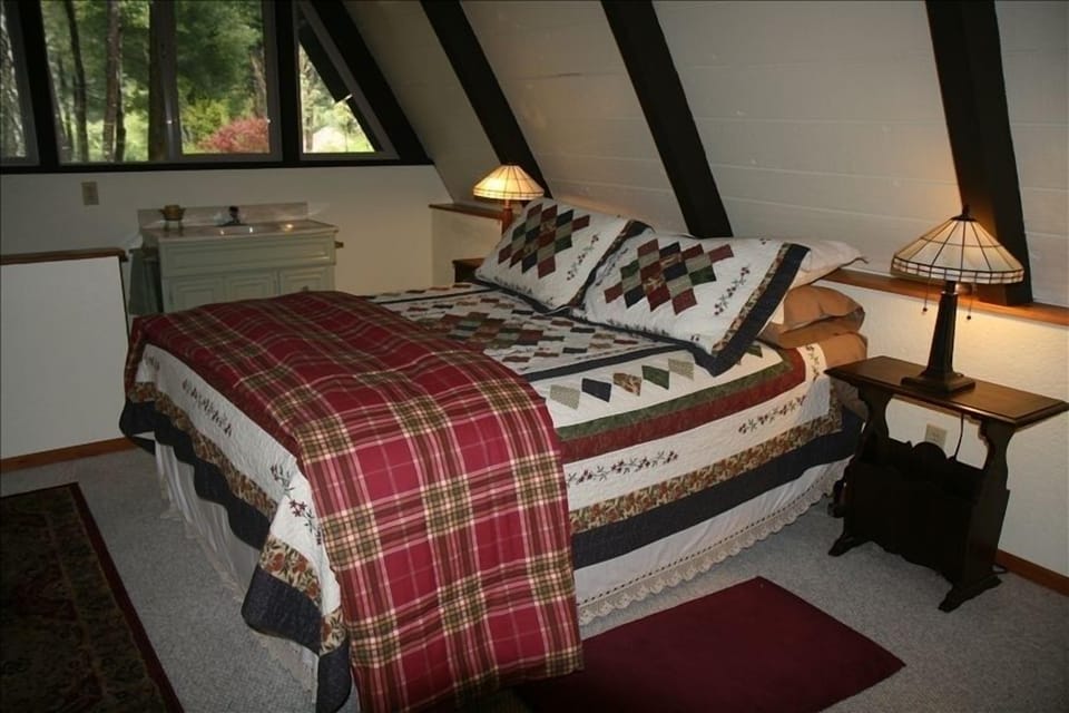 The bedroom and half bath in upstairs loft.