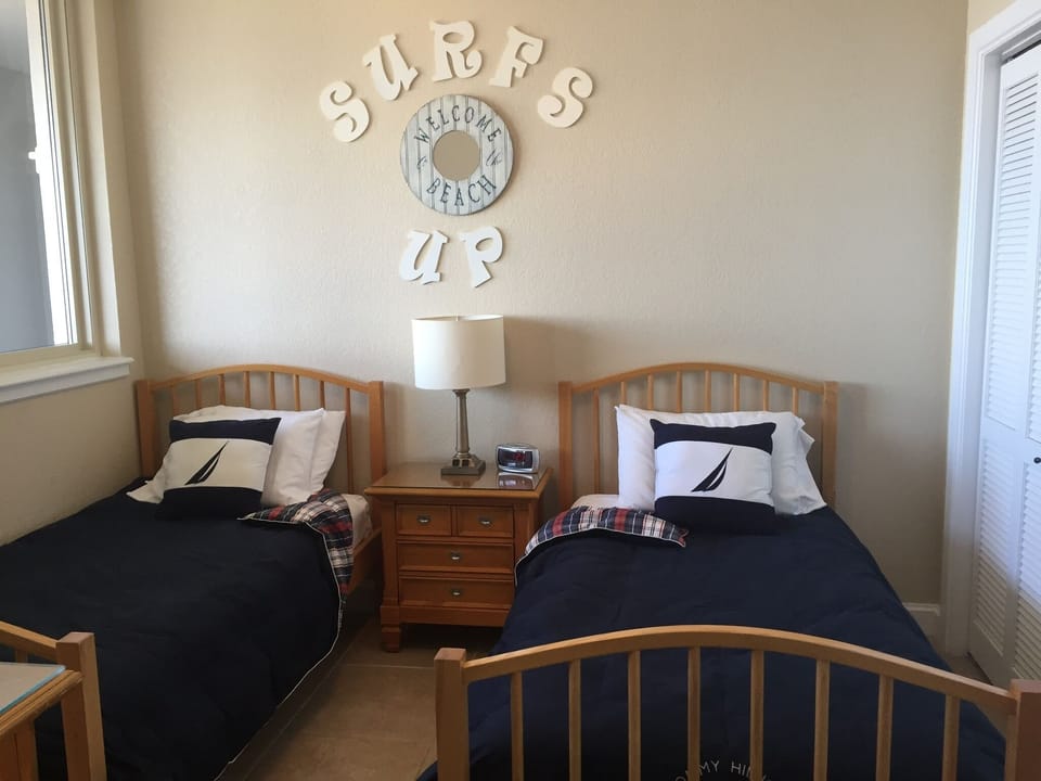 Guest bedroom with two twin beds.