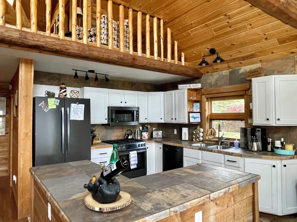 Updated and fully stocked kitchen makes cooking a pleasure.