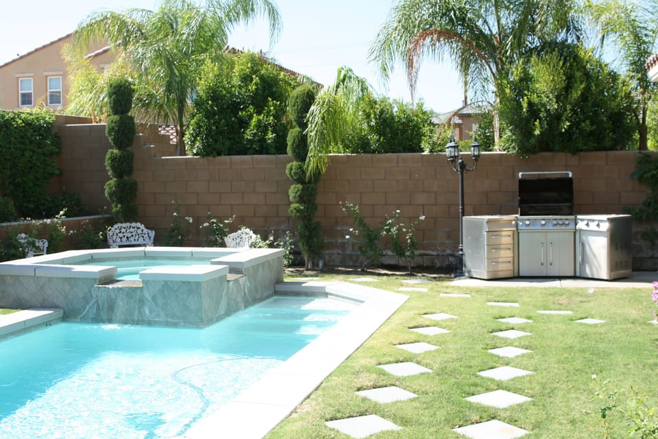 Our awesome backyard and pool, try out the JennAir BBQ!!