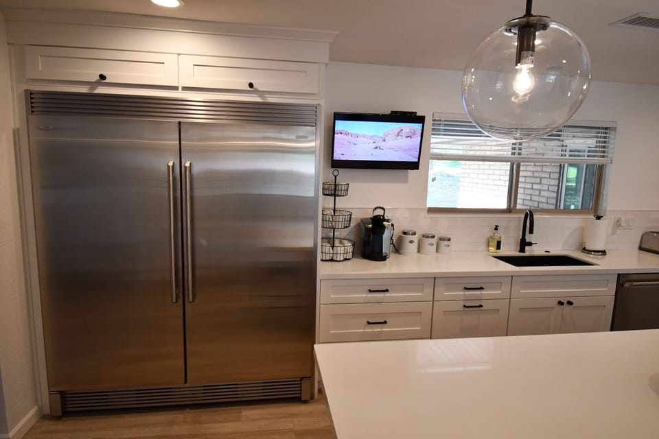 Over sized fridge with tv so you don't feel left out when cooking
