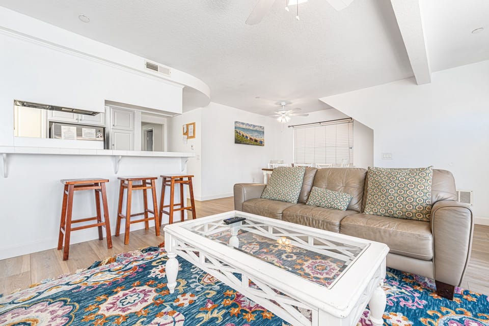 Relax in the inviting living room, a comfortable space to gather, unwind, and enjoy time together
                