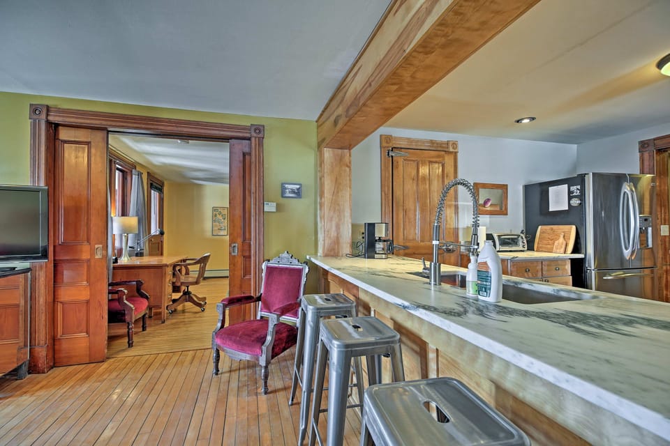 West Wing living room.  Hardwood floors throughout. Original brass hardware