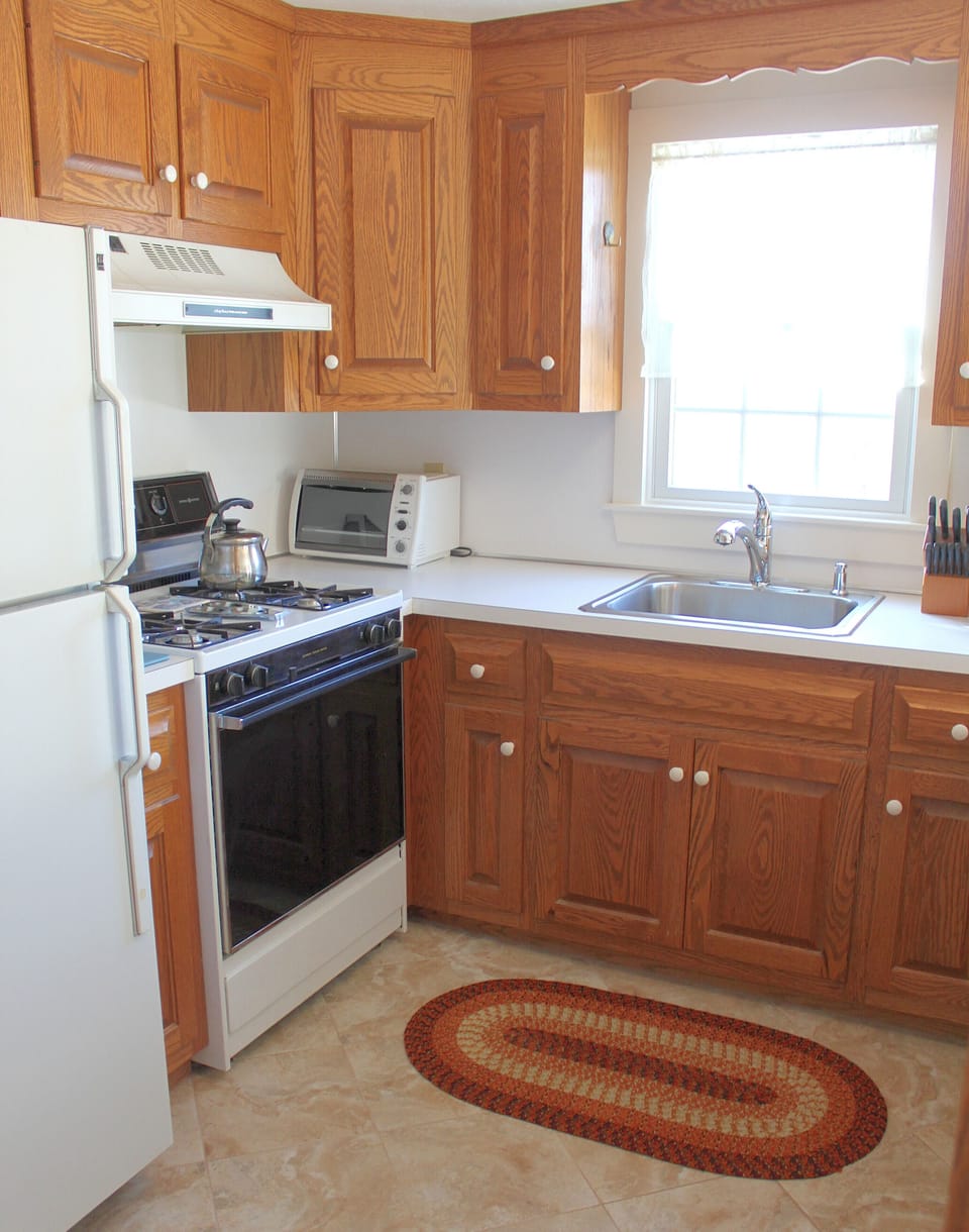 Full Kitchen; Gas Stove, Dishwasher, Refrig, Coffee maker, Microwave & supplies