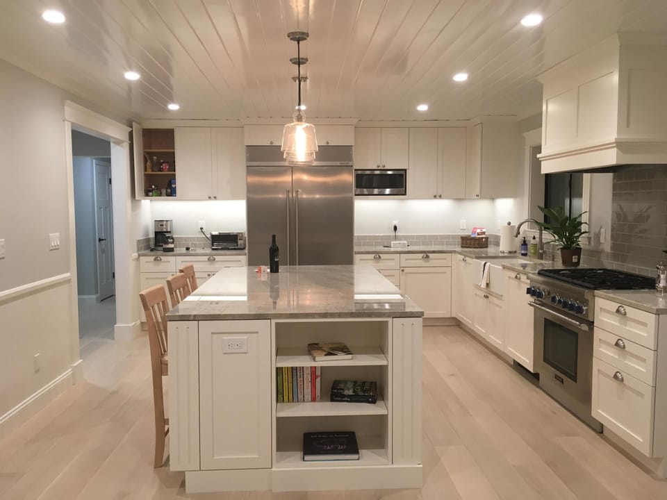 Newly remodeled kitchen with large fridge, wine fridge, dishwasher