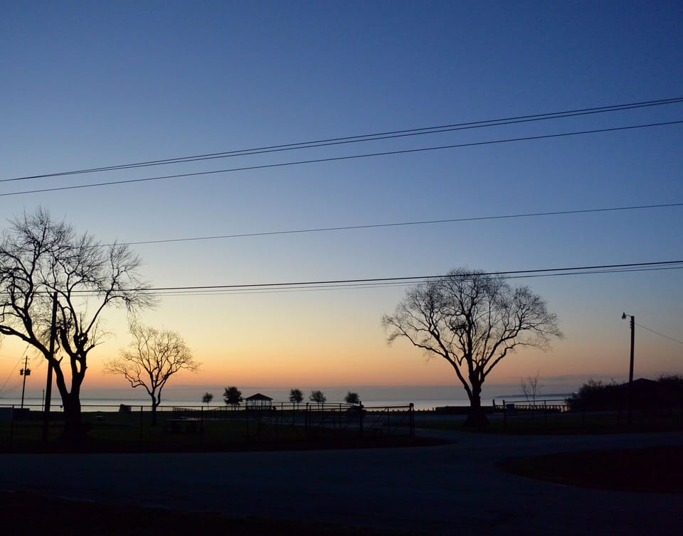 Early birds can watch the sun rise over the bay.