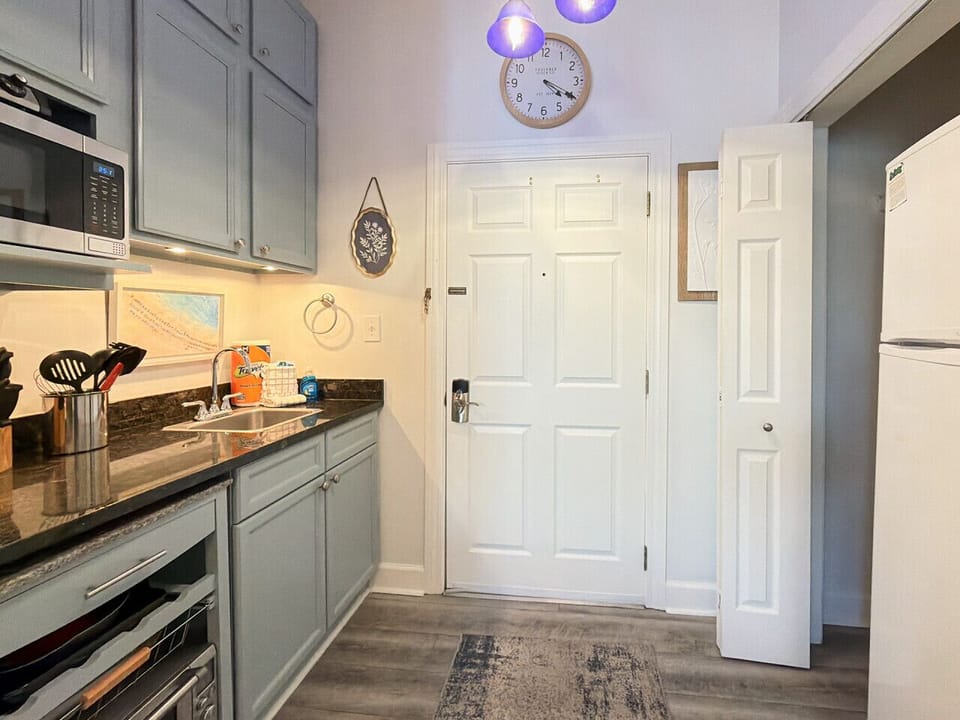 Kitchenette houses a full size refrigerator/freezer
