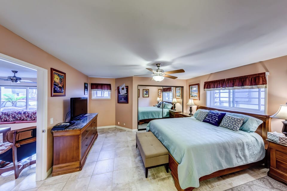 Spacious King Master bedroom with tile floor and   large dresser,DVD & TV