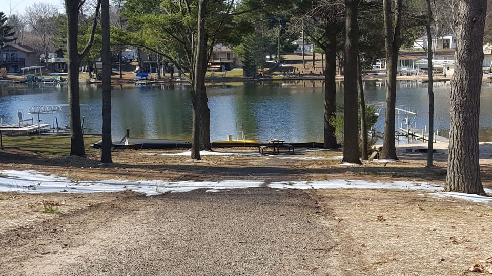 Lake lot across the street with beach and swimming raft.  