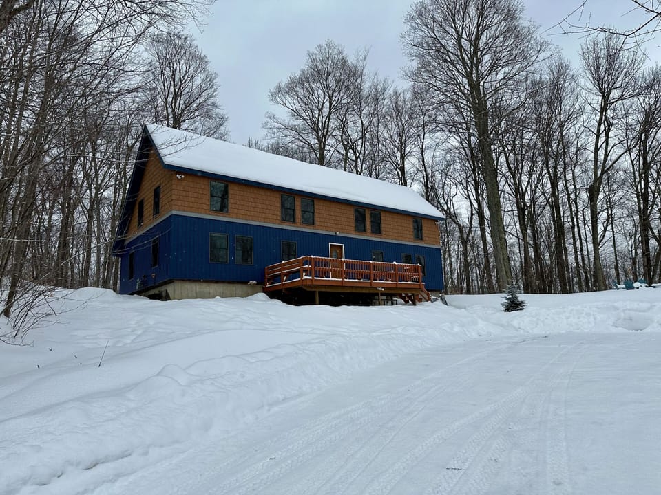 Winter exterior view of The Cabin at Killington, our vacation rental home in Killington, Vermont.