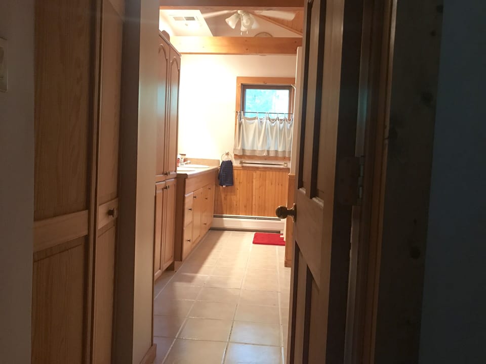 Walk through closets to Master bathroom with double sinks and shower/tub.
