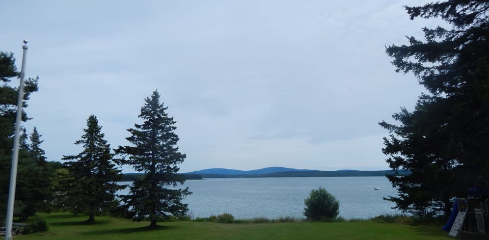 looking over large lawn toward ocean
