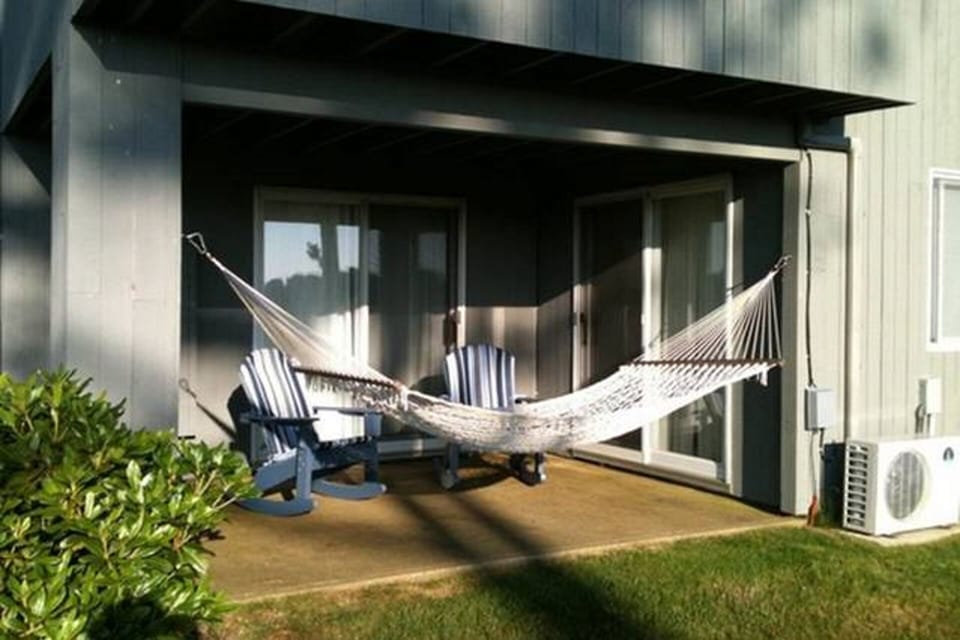 Outdoor Patio with Hammock, Rocking Chairs and an outdoor Shower.