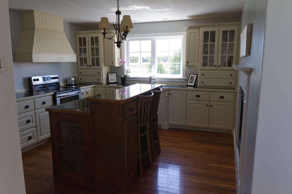 Kitchen overlooking  water, not in view large pantry, fridge, microwave,