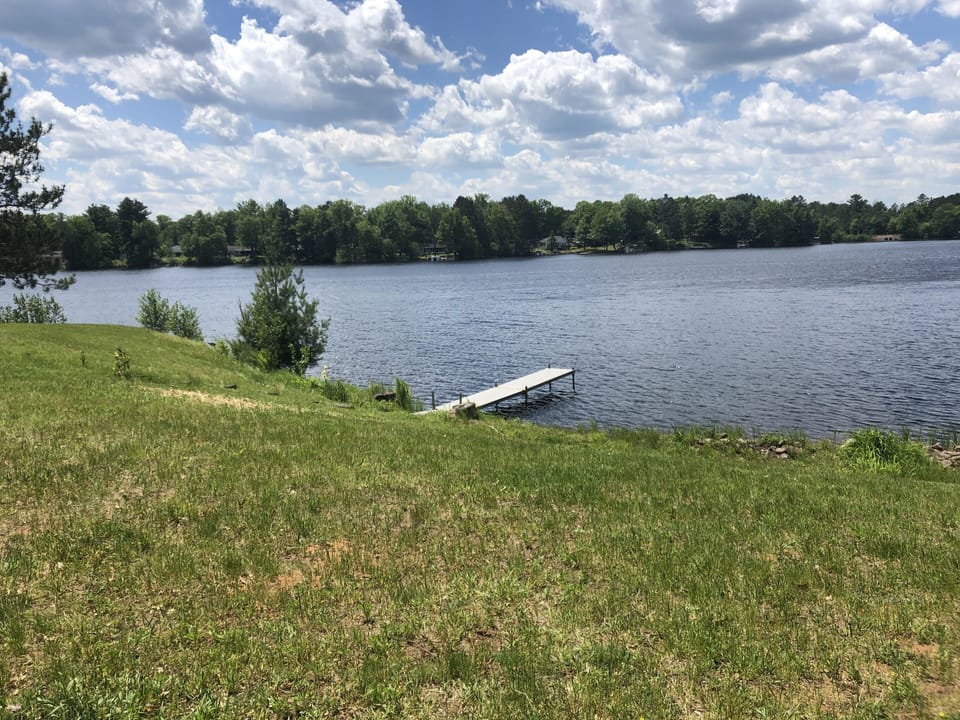 View from patio. Small swimming area to the left of dock. 