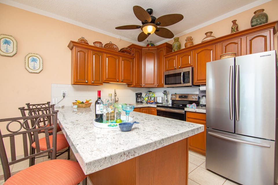 The bar is open. Large kitchen opens to the dining area